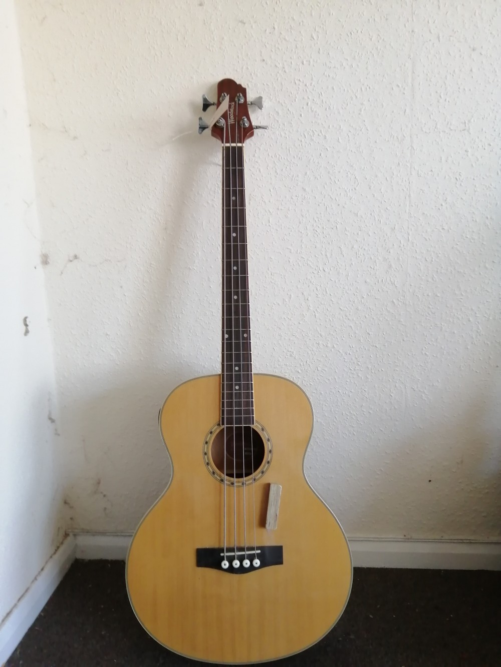 A Woodstock electro acoustic bass guitar
